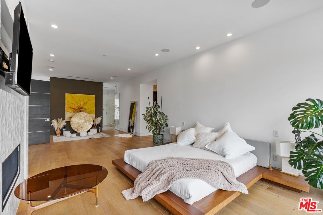 Bedroom, Fireplace, Interior, Recessed Lighting, Wood Texture Flooring