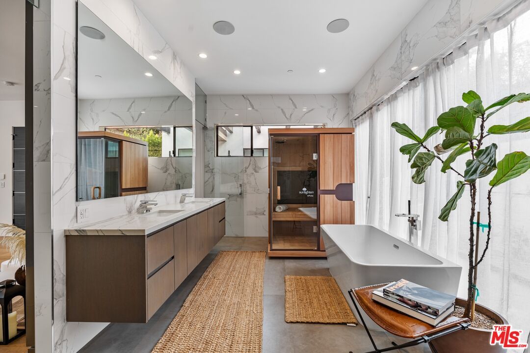 Bathroom, Dual Sink Vanities, Free Standing Baths, Glass Shower, Interior, Marble Walls, Recessed Lighting