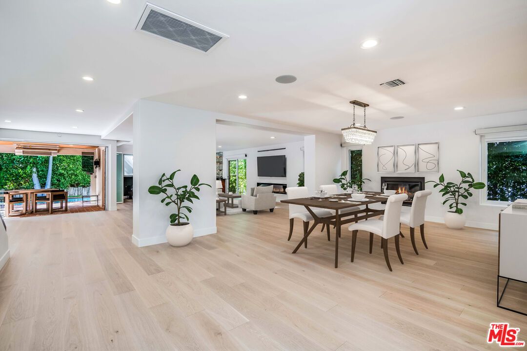 Chandelier, Dining room, Fireplace, Interior, Living room, Recessed Lighting, Wood Texture Flooring