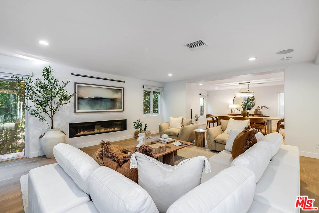 Dining room, Fireplace, Interior, Living room, Pendant Lights, Recessed Lighting, Wood Texture Flooring