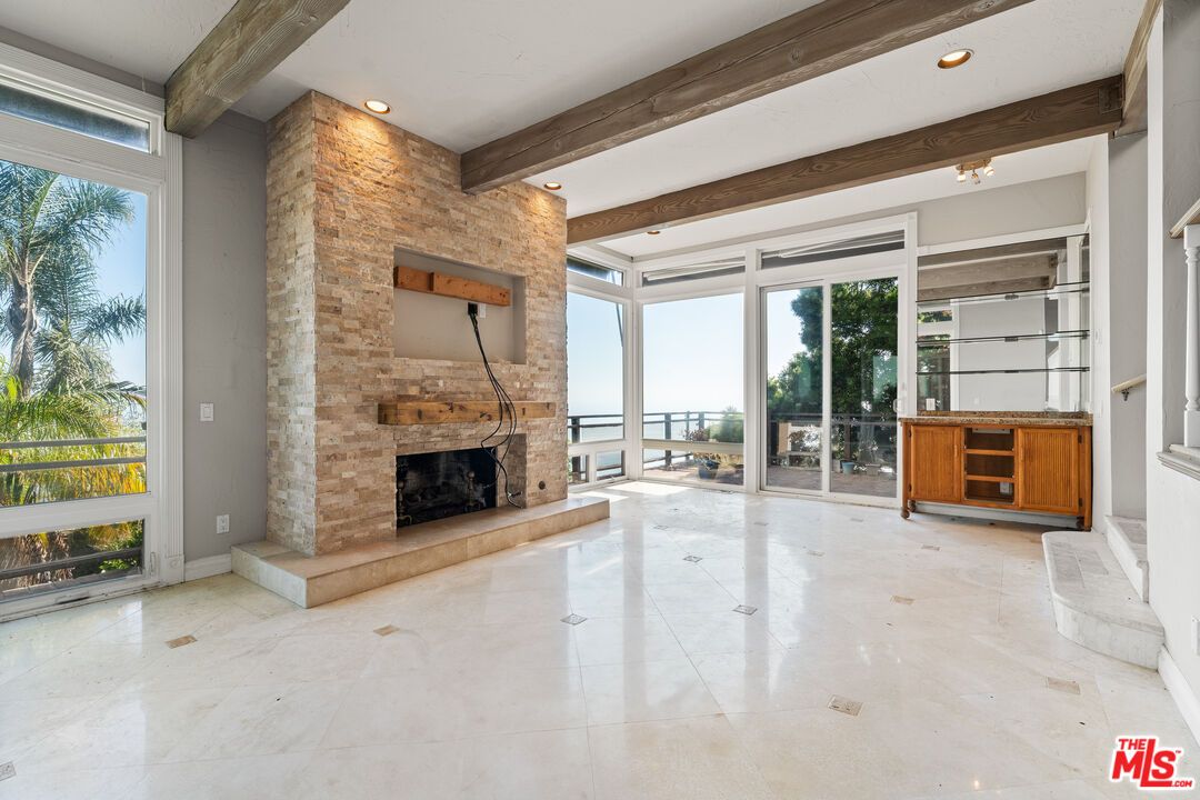 Empty room, Fireplace, Interior, Recessed Lighting, Stone Walls, Wooden Beams