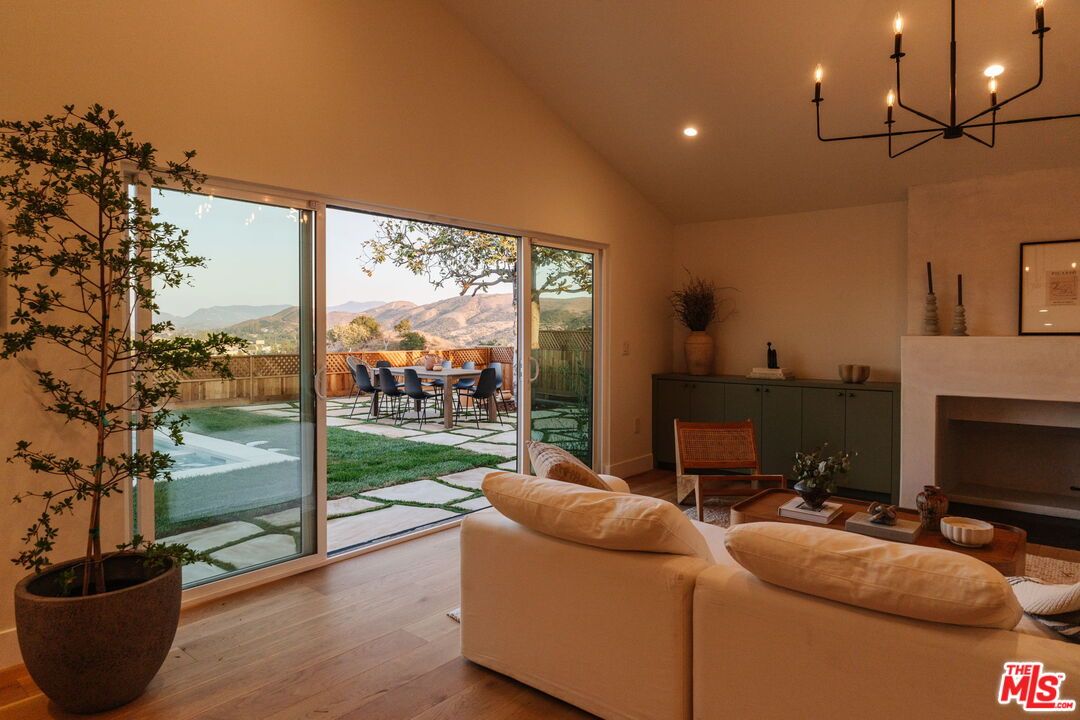 Chandelier, Dining room, Fireplace, Interior, Living room, Recessed Lighting, Wood Texture Flooring