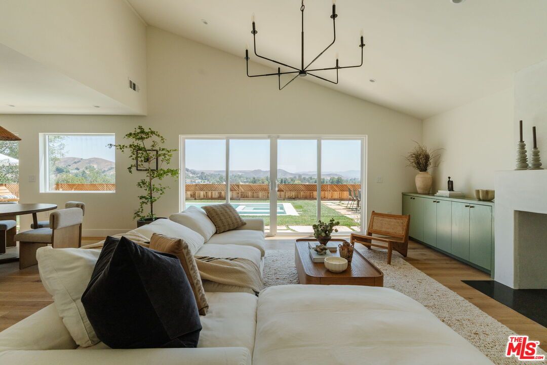 Chandelier, Dining room, Fireplace, Interior, Living room, Recessed Lighting, Wood Texture Flooring
