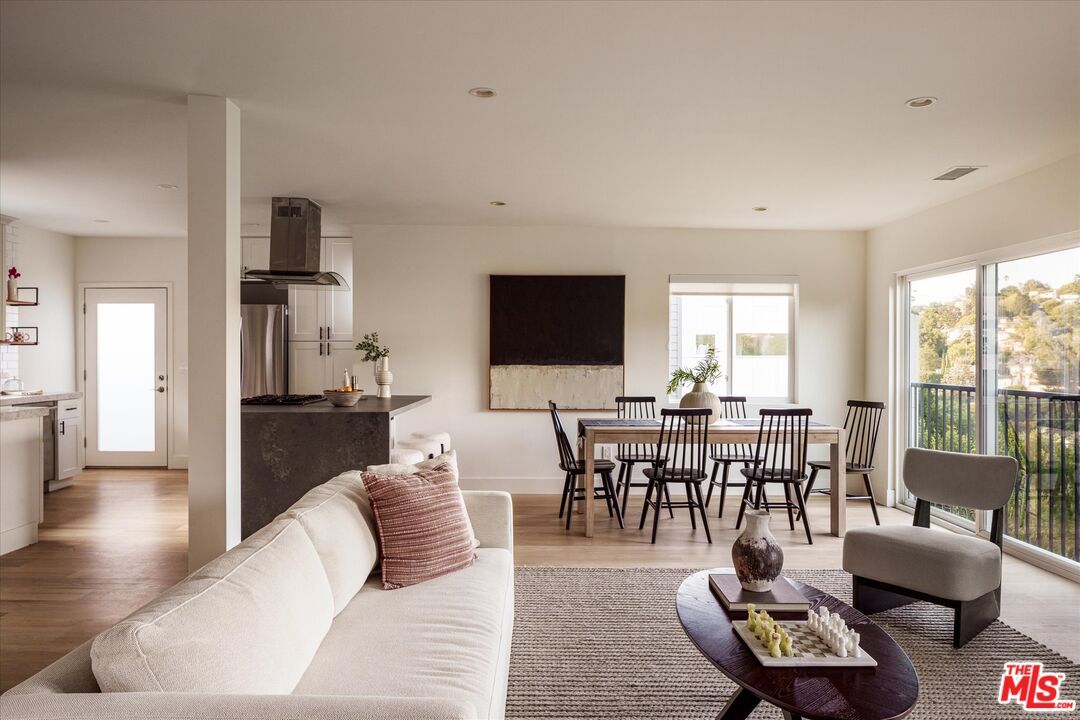 Dining room, Interior, Kitchen, Living room, Recessed Lighting, Stainless Steel Appliances, Wood Texture Flooring