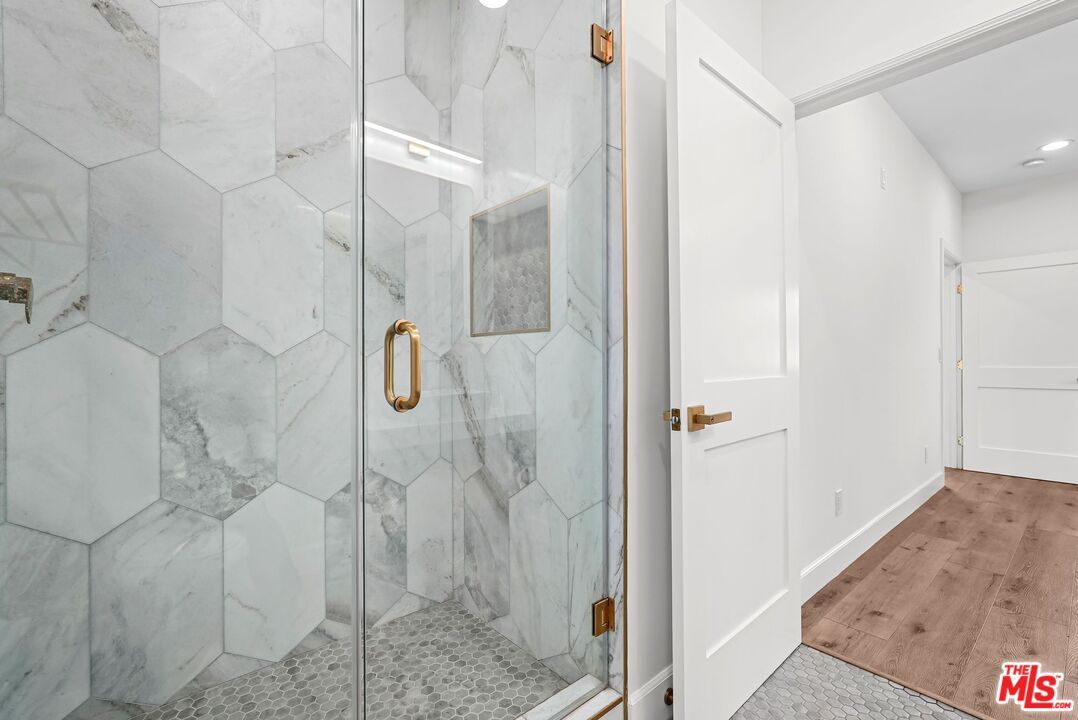 Bathroom, Glass Shower, Interior, Marble Walls, Recessed Lighting, Wood Texture Flooring