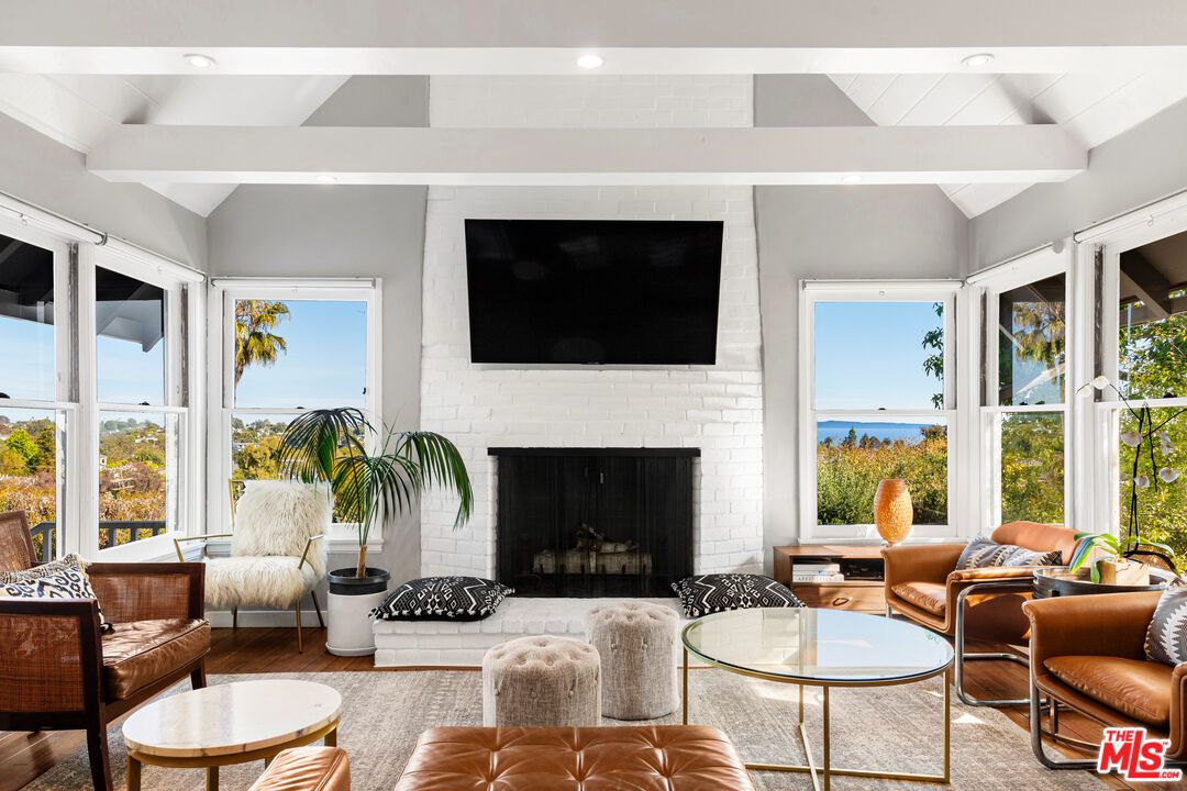 Fireplace, Interior, Living room, Recessed Lighting, Stone Walls, Water, Wood Texture Flooring