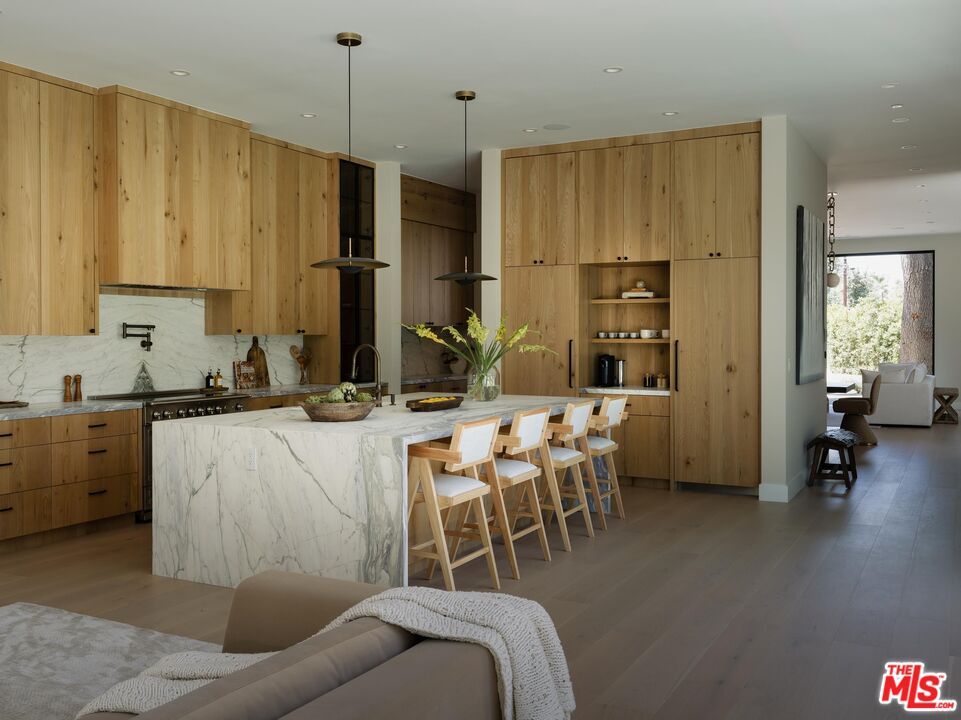 Interior, Kitchen, Marble Walls, Pendant Lights, Recessed Lighting, Stainless Steel Appliances, Wood Texture Flooring