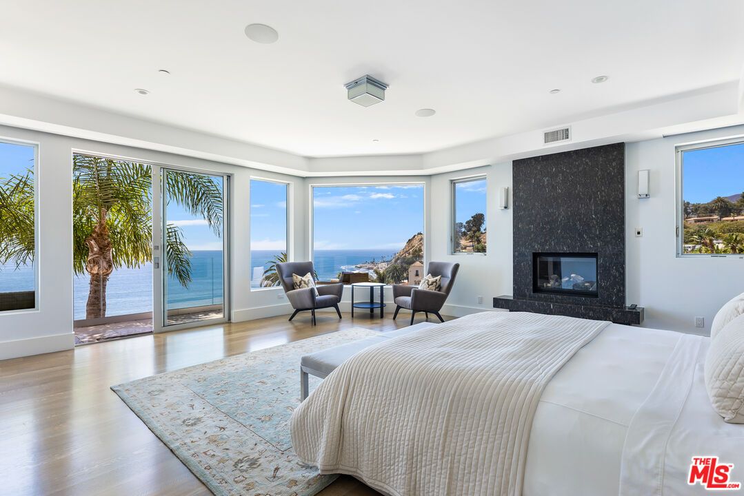 Bedroom, Fireplace, Interior, Recessed Lighting, Water, Wood Texture Flooring