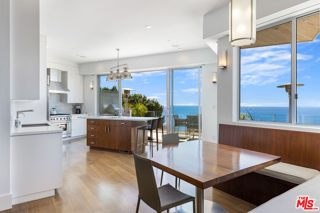Dining room, Interior, Kitchen, Pendant Lights, Recessed Lighting, Stainless Steel Appliances, Water, Wood Texture Flooring