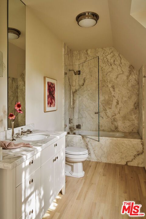 Bathroom, Dual Sink Vanities, Glass Shower, Interior, Marble Walls, Wood Texture Flooring