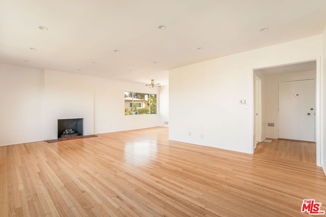 Chandelier, Empty room, Fireplace, Interior, Recessed Lighting, Wood Texture Flooring