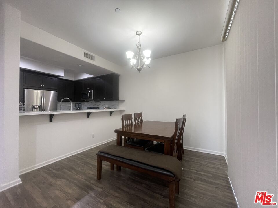 Chandelier, Dining room, Interior, Kitchen, Stainless Steel Appliances, Wood Texture Flooring