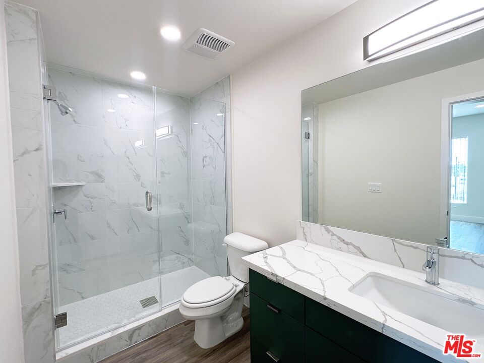 Bathroom, Glass Shower, Interior, Marble Walls, Recessed Lighting, Wood Texture Flooring