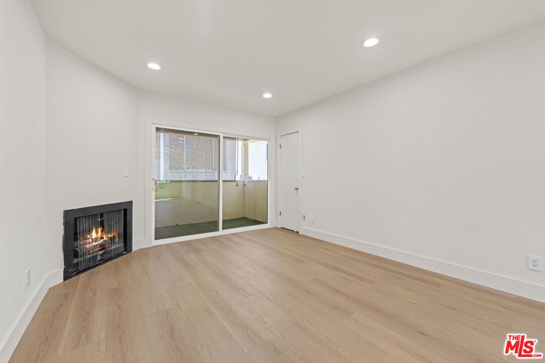 Empty room, Fireplace, Interior, Recessed Lighting, Wood Texture Flooring