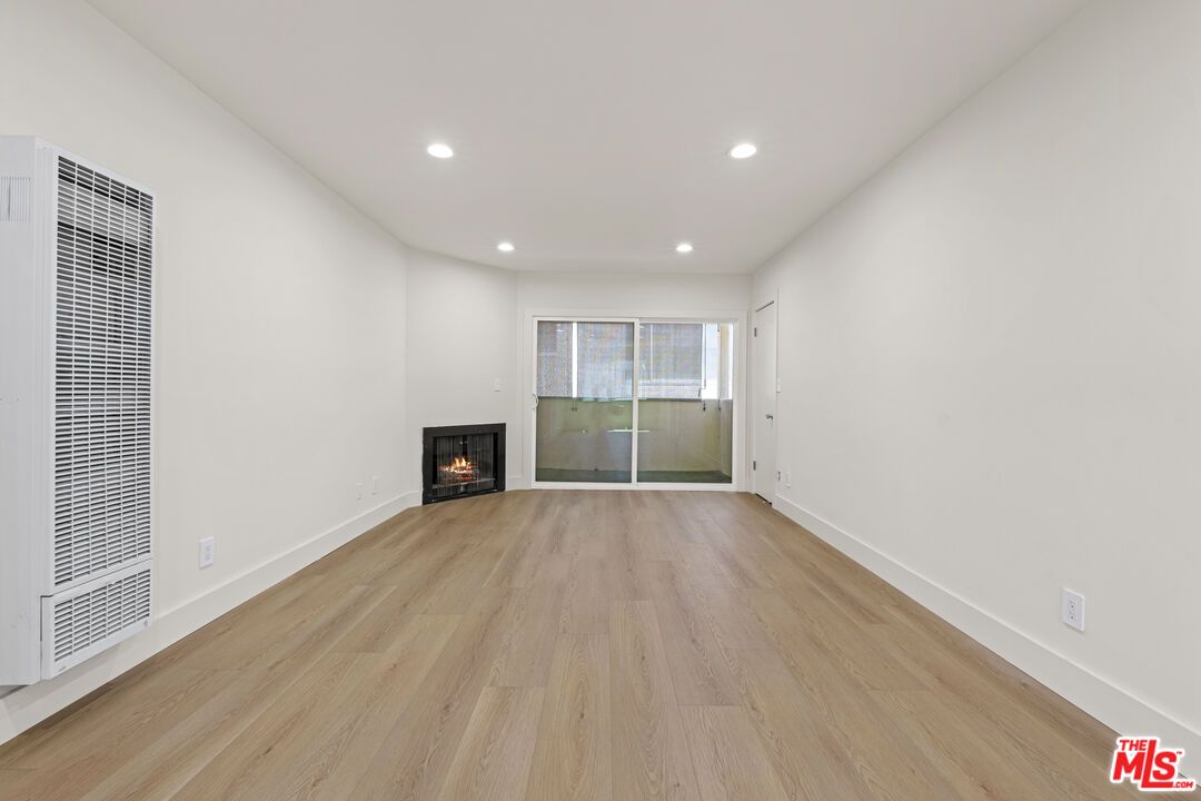 Empty room, Fireplace, Interior, Recessed Lighting, Wood Texture Flooring