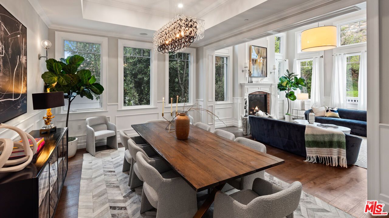 Chandelier, Dining room, Fireplace, Interior, Living room, Pendant Lights, Recessed Lighting, Wood Texture Flooring