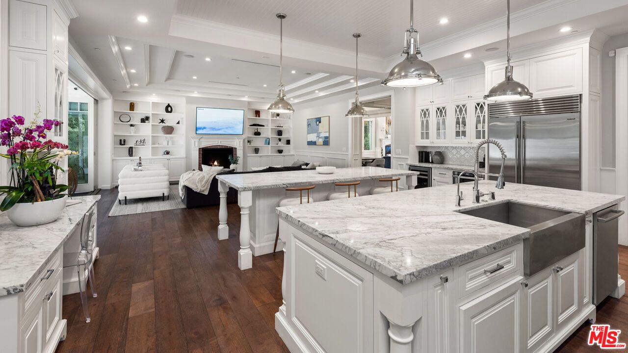 Fireplace, Interior, Kitchen, Living room, Pendant Lights, Recessed Lighting, Stainless Steel Appliances, Wood Texture Flooring