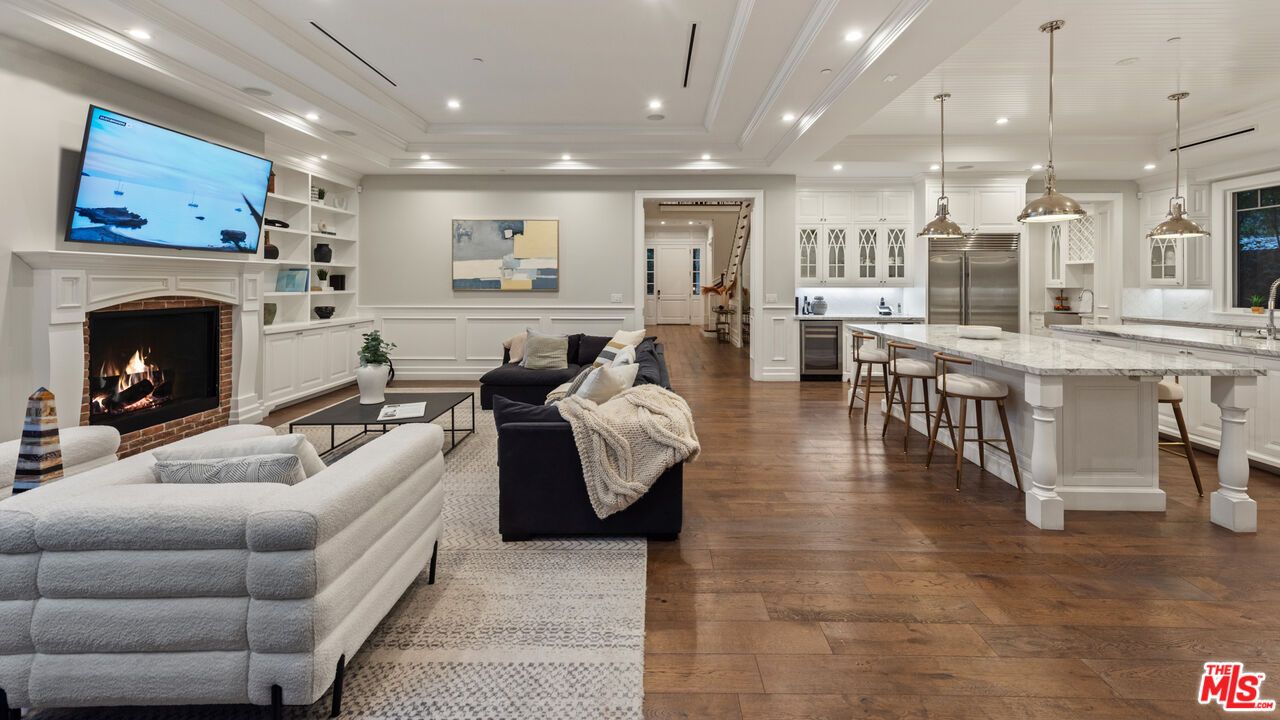 Fireplace, Interior, Kitchen, Living room, Pendant Lights, Recessed Lighting, Stainless Steel Appliances, Wood Texture Flooring
