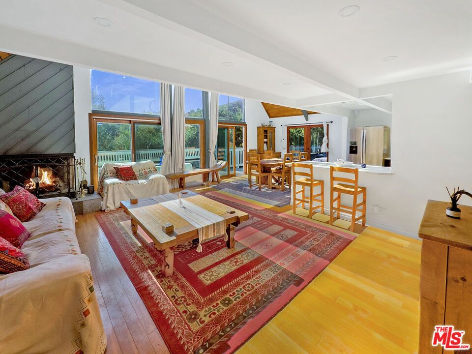 Dining room, Fireplace, Interior, Living room, Recessed Lighting, Wood Texture Flooring