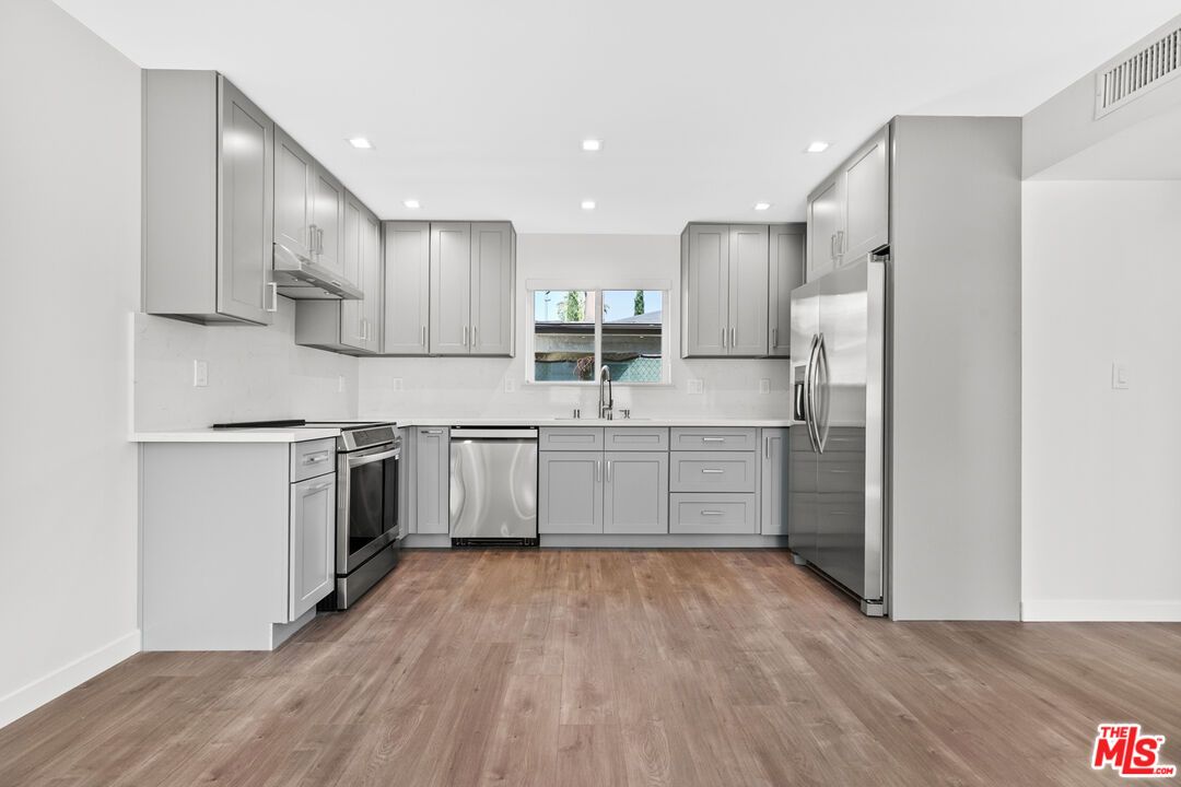 Interior, Kitchen, Recessed Lighting, Stainless Steel Appliances, Wood Texture Flooring