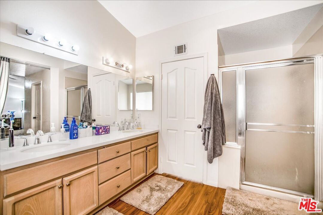 Bathroom, Dual Sink Vanities, Glass Shower, Interior, Wood Texture Flooring