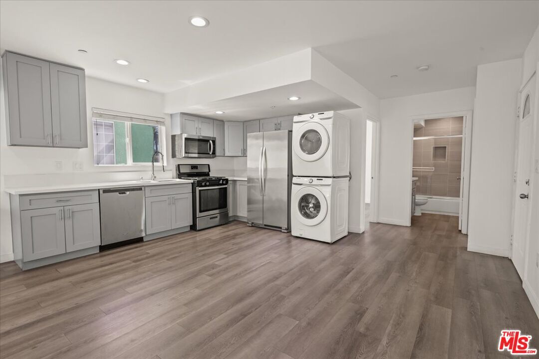 Interior, Kitchen, Recessed Lighting, Stainless Steel Appliances, Washer, Wood Texture Flooring