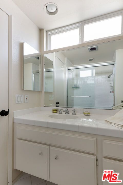 Bathroom, Dual Sink Vanities, Glass Shower, Interior, Recessed Lighting, Tile Countertops