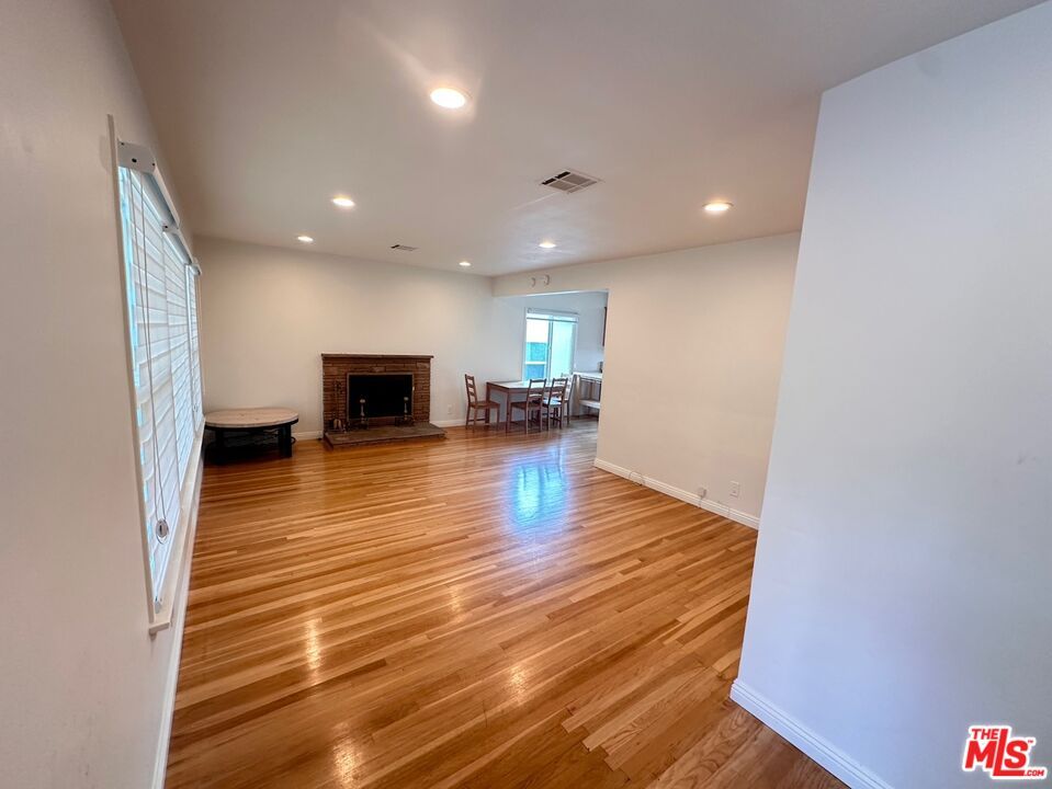 Dining room, Empty room, Fireplace, Interior, Recessed Lighting, Wood Texture Flooring