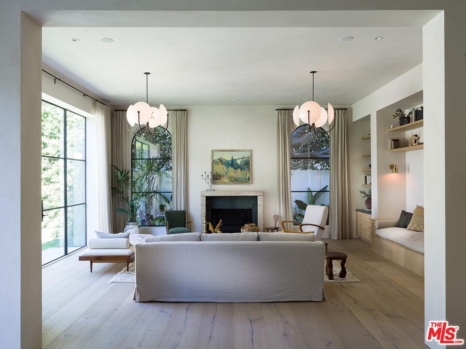 Chandelier, Fireplace, Interior, Living room, Pendant Lights, Recessed Lighting, Wood Texture Flooring