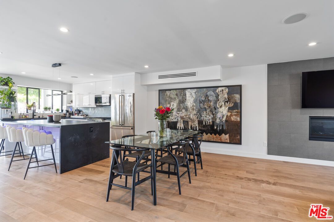 Dining room, Fireplace, Interior, Kitchen, Pendant Lights, Recessed Lighting, Stainless Steel Appliances, Wood Texture Flooring