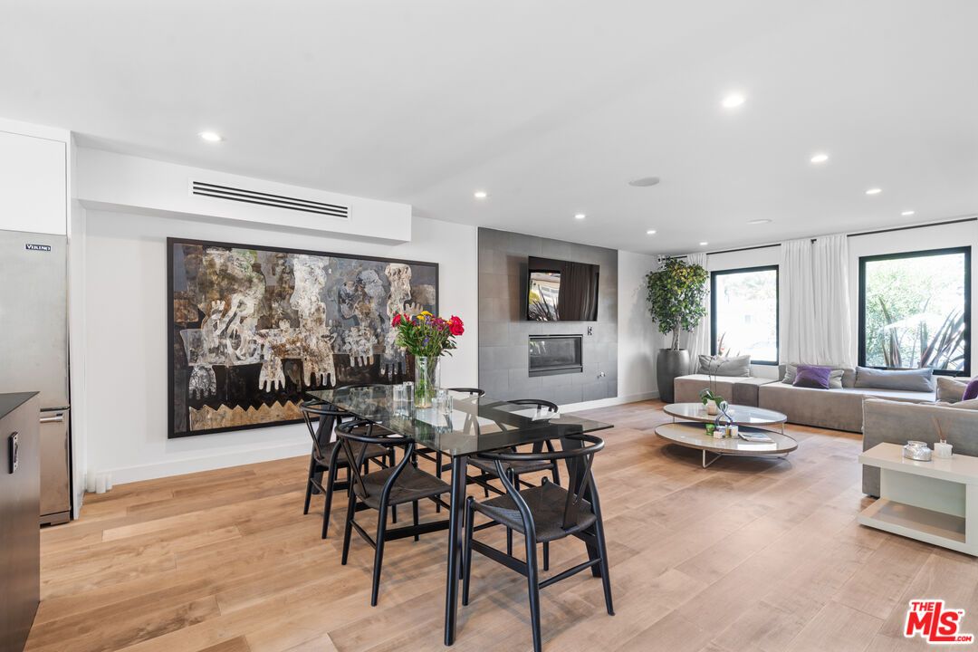 Dining room, Fireplace, Interior, Living room, Recessed Lighting, Wood Texture Flooring