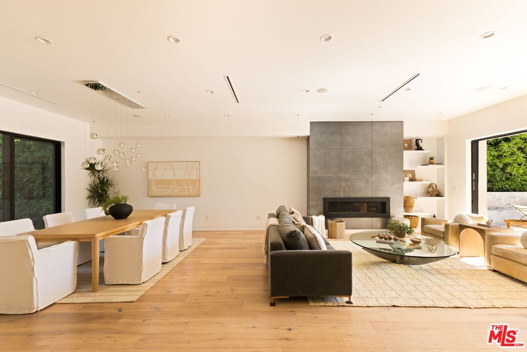 Dining room, Fireplace, Interior, Living room, Pendant Lights, Recessed Lighting, Wood Texture Flooring