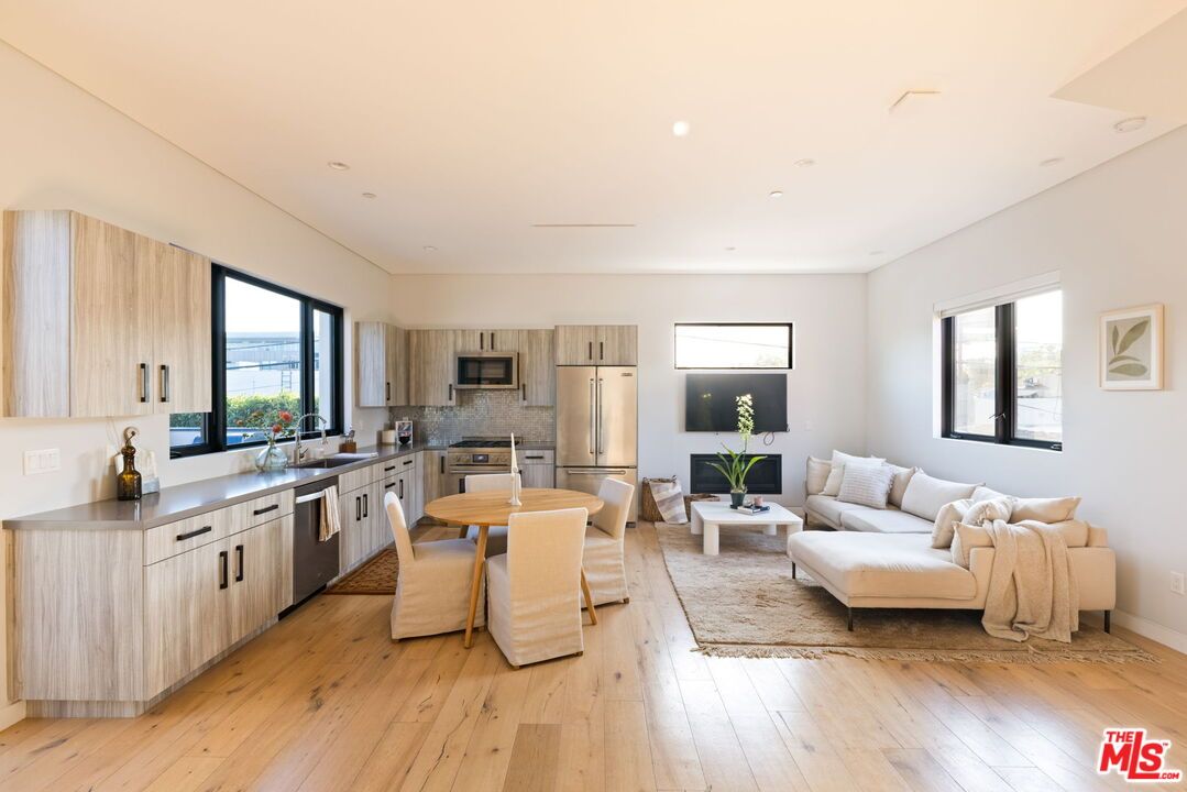 Dining room, Interior, Kitchen, Living room, Recessed Lighting, Stainless Steel Appliances, Wood Texture Flooring