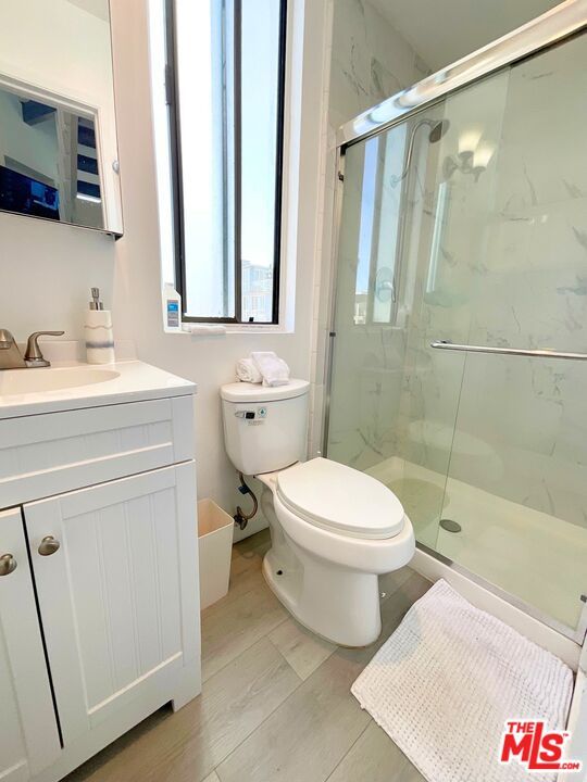 Bathroom, Glass Shower, Interior, Marble Walls, Wood Texture Flooring