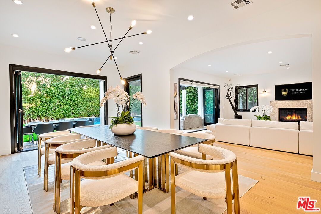 Dining room, Fireplace, Interior, Living room, Pendant Lights, Recessed Lighting, Wood Texture Flooring