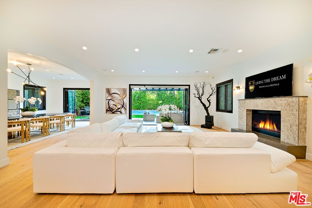 Dining room, Fireplace, Interior, Living room, Pendant Lights, Recessed Lighting, Wood Texture Flooring