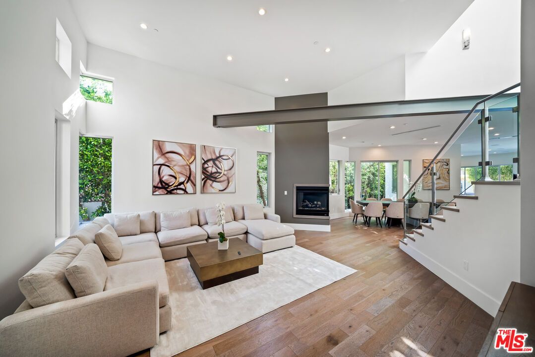 Dining room, Fireplace, Interior, Living room, Recessed Lighting, Wood Texture Flooring