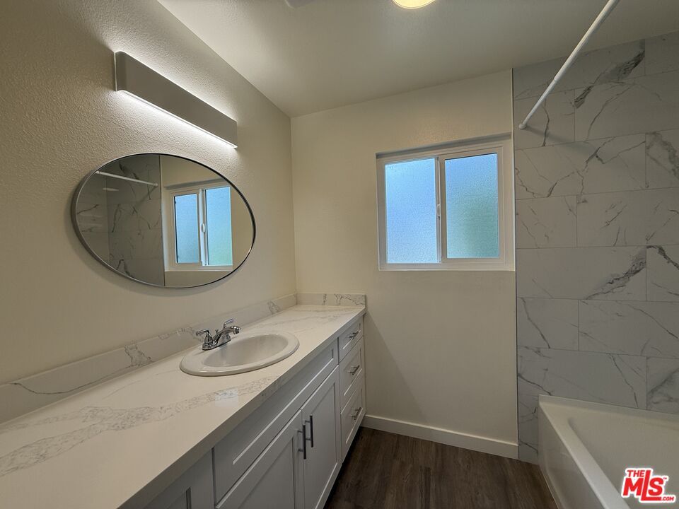 Bathroom, Dual Sink Vanities, Interior, Marble Walls, Wood Texture Flooring