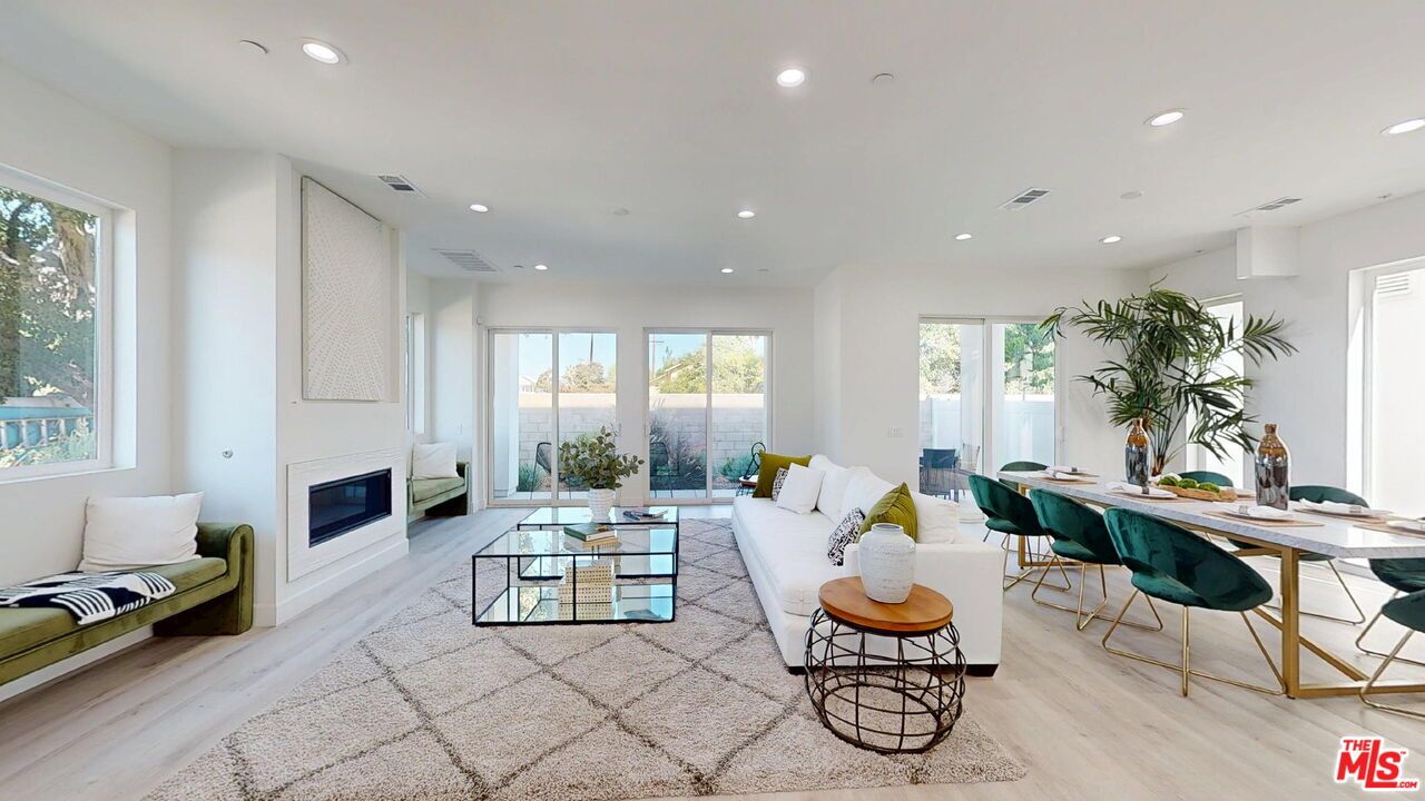 Dining room, Fireplace, Interior, Living room, Recessed Lighting, Wood Texture Flooring