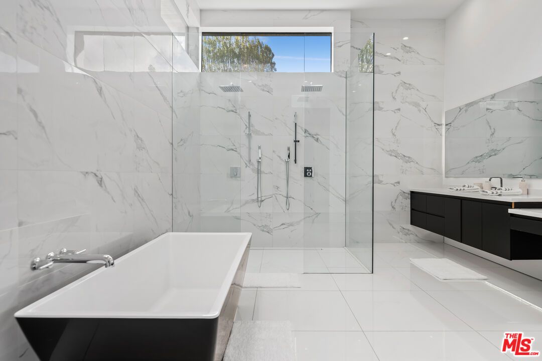 Bathroom, Dual Sink Vanities, Free Standing Baths, Glass Shower, Interior, Marble Walls, Recessed Lighting