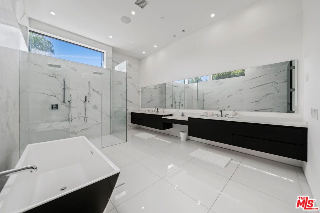 Bathroom, Dual Sink Vanities, Free Standing Baths, Glass Shower, Interior, Marble Walls, Recessed Lighting