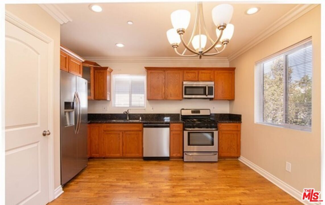 Chandelier, Interior, Kitchen, Recessed Lighting, Stainless Steel Appliances, Wood Texture Flooring