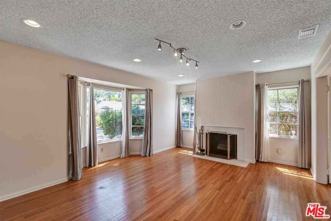 Empty room, Fireplace, Interior, Recessed Lighting, Wood Texture Flooring