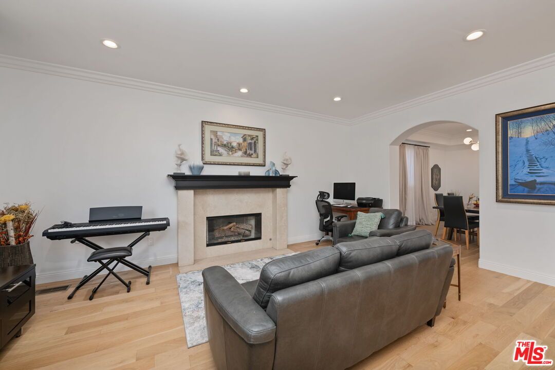 Dining room, Fireplace, Interior, Living room, Piano, Recessed Lighting, Wood Texture Flooring