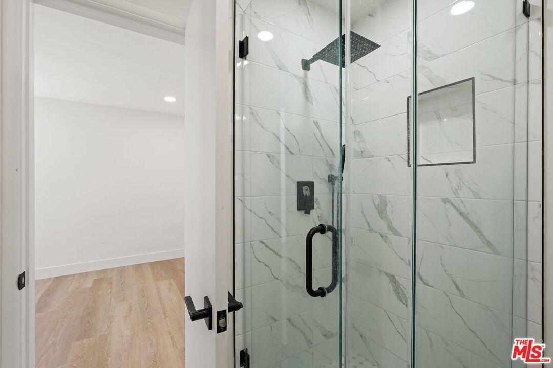 Bathroom, Glass Shower, Interior, Marble Walls, Recessed Lighting, Wood Texture Flooring