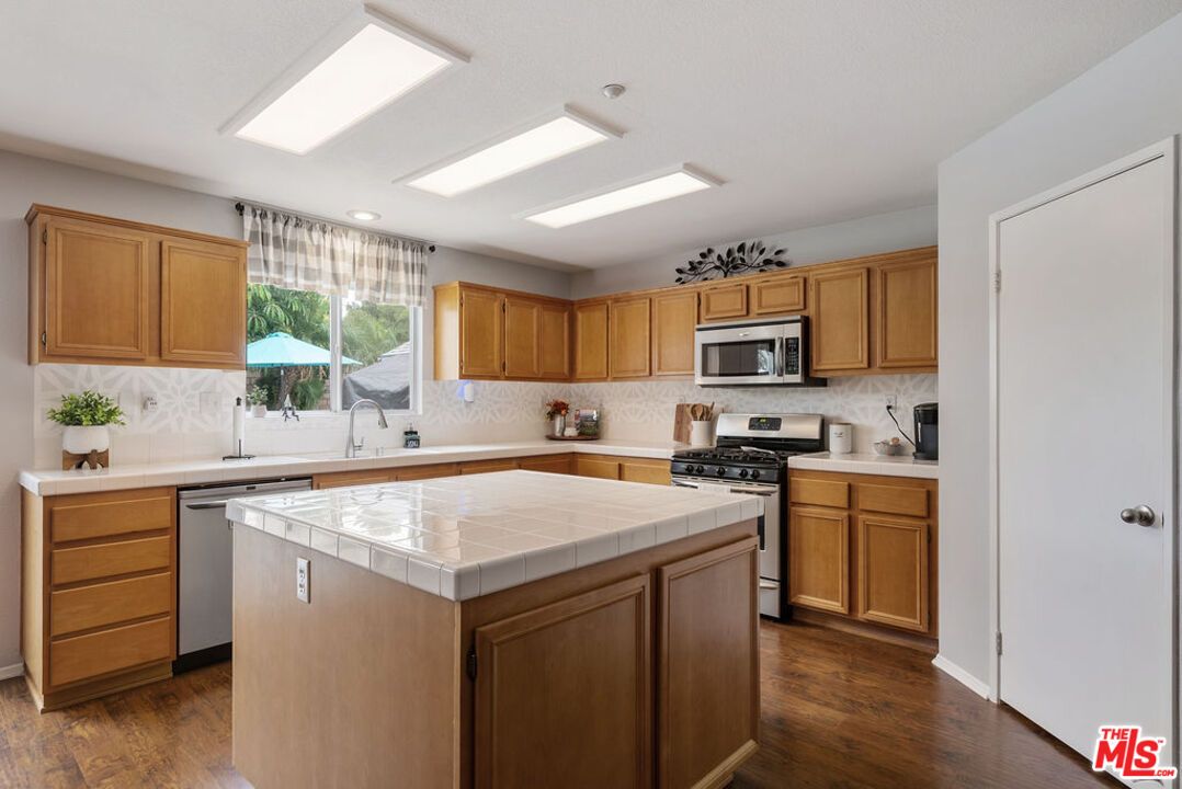 Interior, Kitchen, Recessed Lighting, Stainless Steel Appliances, Tile Countertops, Wood Texture Flooring