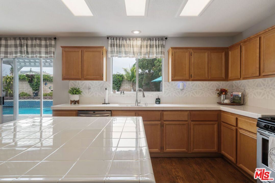 Interior, Kitchen, Recessed Lighting, Stainless Steel Appliances, Tile Countertops, Wood Texture Flooring