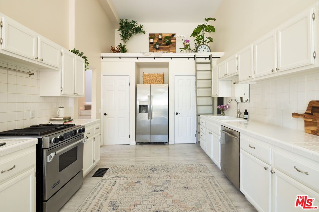 Interior, Kitchen, Stainless Steel Appliances, Tile Countertops, Wood Texture Flooring