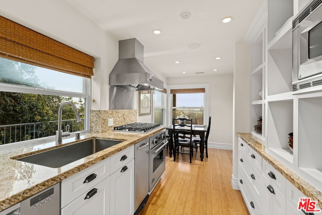 Dining room, Interior, Kitchen, Recessed Lighting, Stainless Steel Appliances, Wood Texture Flooring