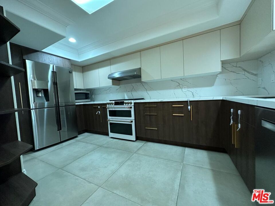 Interior, Kitchen, Marble Walls, Recessed Lighting, Stainless Steel Appliances